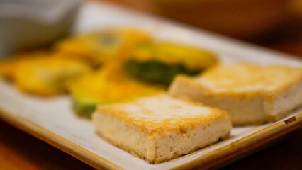 Tofu and pumpkin baked in a frying pan