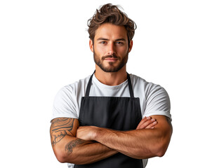 Young male chef in casual attire poses confidently with arms crossed, showcasing a strong physique and tattooed arms