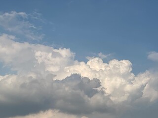 Fototapeta premium Clouds in a Clear Blue Sky