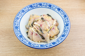 A bowl of pickled fish fillet