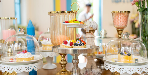 A Sweet Symphony: Pastel hues and delicate desserts create a whimsical wonderland on a beautifully set table, promising a delightful celebration. 