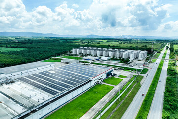 Solar energy for factory and warehouse building. Solar panels on roof of industrial plant....