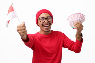 Happy Indonesian man is raising his fist in a celebratory 