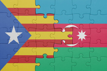 puzzle with the colourful national flag of azerbaijan and flag of catalonia.