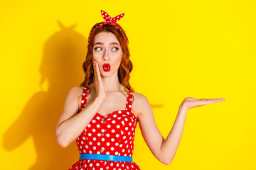 Photo of lovely pretty cute lady wear red dress arm hold empty space isolated on vivid yellow color background