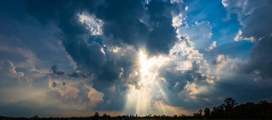 Sun rays through storm clouds