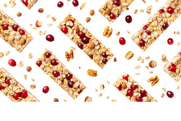 Creative display of granola muesli cereal bars in rows, with cranberries, walnuts, and nut berries scattered around, isolated on a pristine white background