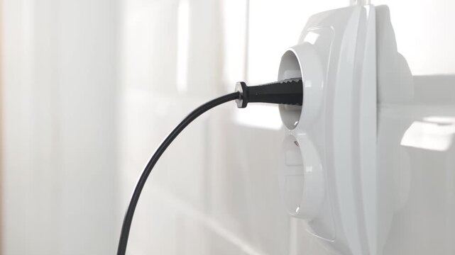 Plugging Electrical Cord in Wall European Socket, Plug in Devices, Electric Power View, Save Cost in Energy Industry Crisis
