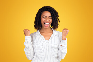 Excited African Woman Screaming With Joy, Feeling Happy, Celebrating Victory. Empty space, yellow...