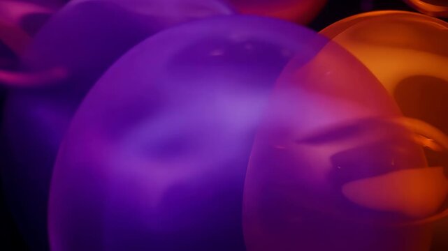 Purple and orange bubbles merging softly with smooth transitions