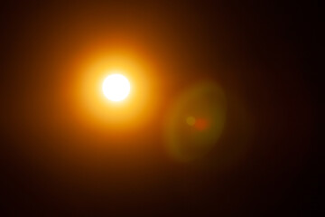 Sun flare on the black background