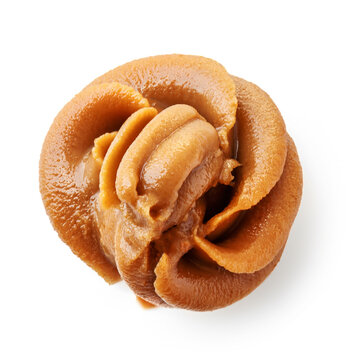 Peanut butter swirl isolated on a white background. Peanut paste top view. Flat lay.