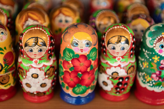 background of colorful Russian Matryoshka, Babushka or nesting dolls on shelf in store