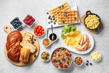 Tasty breakfast. Flat lay composition with many different food on grey textured table