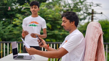 Indian young man doing payment with smartphone using QR code