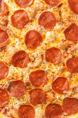 the macro composition of pizza for the menu. fresh ingredients are cheese, ham and tomatoes.