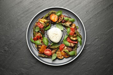 Tasty salad with grilled vegetables and mozzarella cheese on grey textured table, top view
