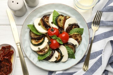 Tasty salad with grilled vegetables and mozzarella cheese served on white wooden table, flat lay