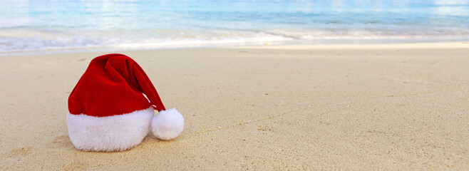 Merry Christmas with Santa hat on the tropical beach