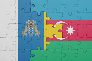 puzzle with the colourful national flag of azerbaijan and flag of canary islands.