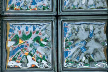 Glass block wall closeup for background. Color abstraction in brick glass wall