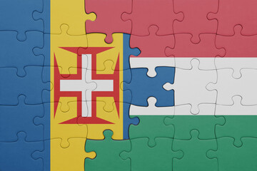 puzzle with the colourful national flag of hungary and flag of madeira.