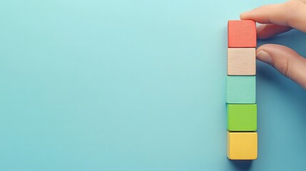  Strategic business growth concept with hand placing green and blue blocks to build an upward graph representing success in marketing and sales. Business planning, and positive trends