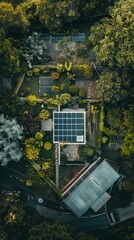 An aerial view of a white building with blue solar panels amid greenery. Four smaller panels present, trees surround, and two cars parked nearby.