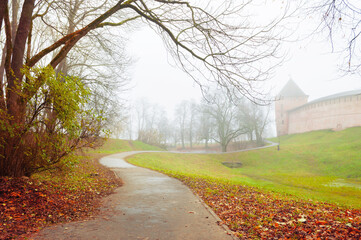 Veliky Novgorod, Russia. Vladimir tower of Veliky Novgorod Kremlin at autumn foggy day. Focus at the Novgorod Kremlin tower