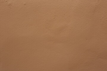 Soil wall texture of clay house structure with sunlight. Mud background