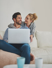 Happy couple, laughing or laptop for support, space and movie streaming online in house living room. Smile, internet and people bonding on social network app, digital website and technology for news