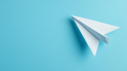 A paper airplane on a blue background.