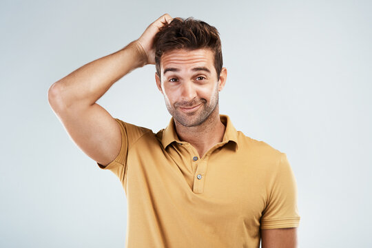 Portrait, confused and man scratch head in studio with unsure or dont know emoji. Face, happy and puzzled expression of model with question, doubt or thinking of decision isolated on white background