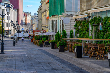 Stoleshnikov lane with tables of cafe in Moscow, Russia. Moscow architecture and landmark. Moscow...