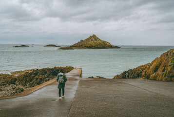person walking on the beach