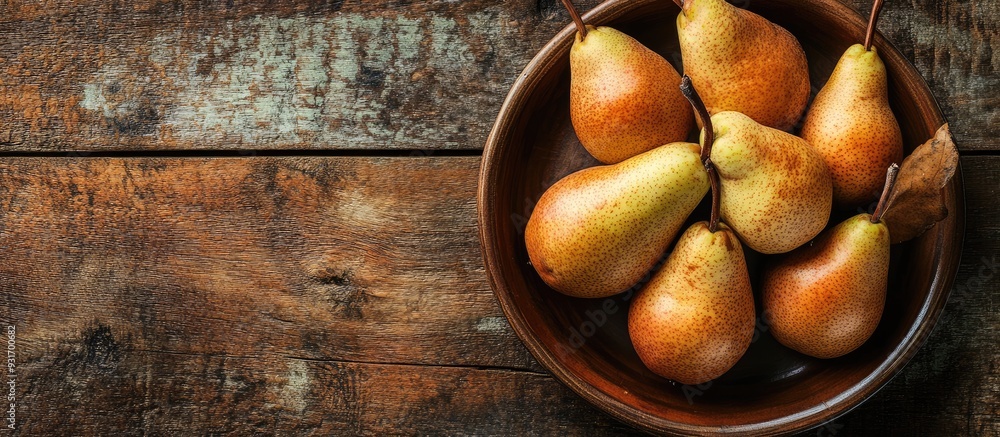 Poster plate with fresh pears on a wooden table. with copy space image. place for adding text or design
