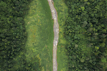 Beautiful aerial view green forest and river in the countryside of Nakhon Nayok Province, Thailand.