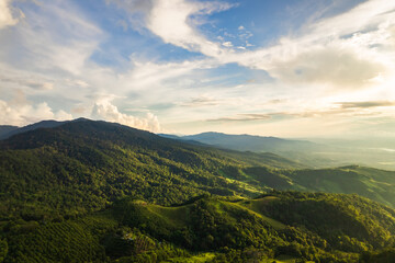 Beautiful sunlight and blue sky with cloud over the mountain of Thailand.