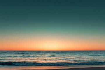 Obraz premium A gradient moving from a warm orange to a cool teal with a subtle grain effect, resembling a sunset over the ocean.