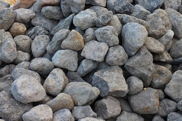 Piles of gravel limestone rock on construction site
