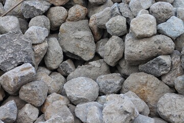 Piles of gravel limestone rock on construction site