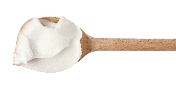 Render lard, pig fat spread on wooden spoon, isolated on white
