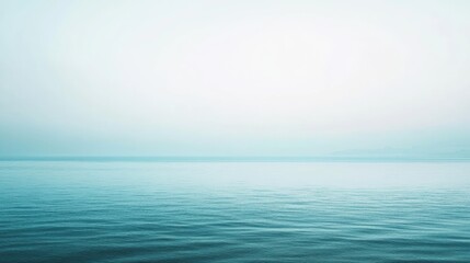 Obraz premium Serene Sea on a Misty Morning