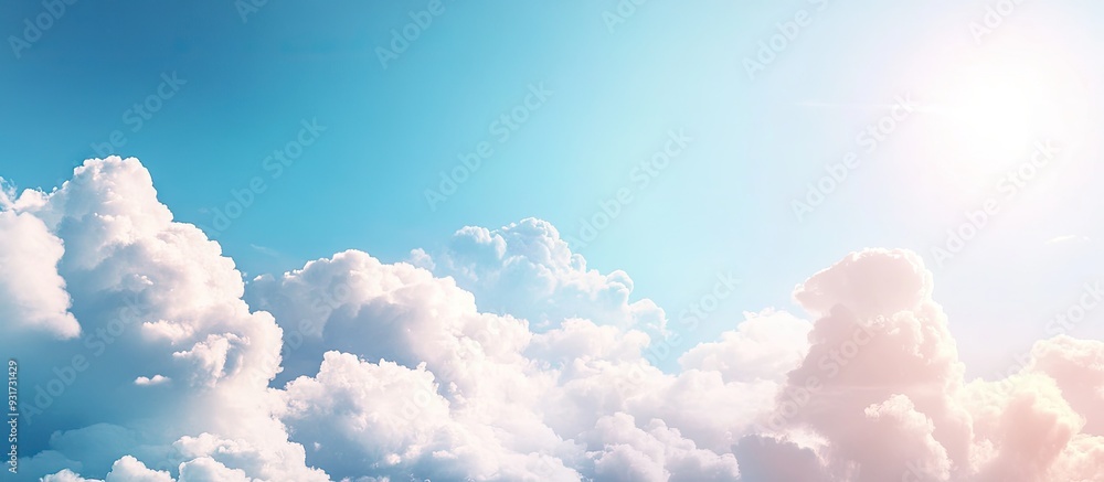 Leinwandbilder Fluffy clouds and sunlight in a blue sky. with copy space image. Place for adding text or design