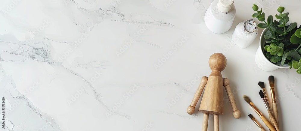 Aufkleber Painting visual art background Paints and a wooden painter figure with brushes on a white desk top view flat lay objects. with copy space image. Place for adding text or design