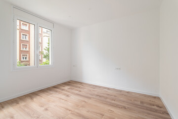 Imagine a bright, modernstyle empty room with wooden flooring and large windows