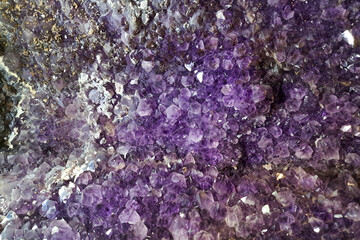 Purple amethyst, close-up. Backgrounds and textures. semiprecious stone.