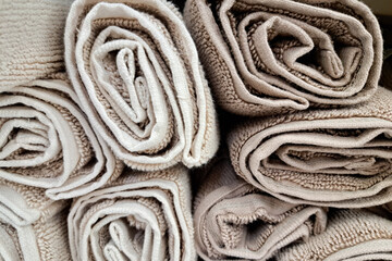 Rolled carpets in a store, close-up. Selection of carpets, carpet store.