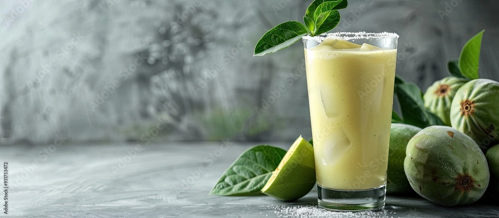 Leinwandbilder fresh feijoa smoothie in a glass on a gray table close up with room for text. with copy space image.