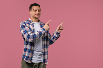 Recommending man pointing right side, copy space.Male model presenting something